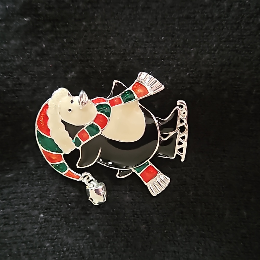 Shiny ice skating penguin holiday pin with red & green scarf / hat & jingle bell